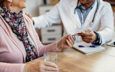Caregiver helping elderly parent apply for prescription assistance online