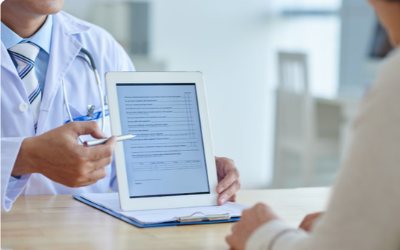 Patient and doctor completing a patient assistance program application
